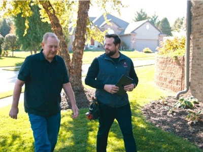 Radon Contractor and Homeowner outside during consultation